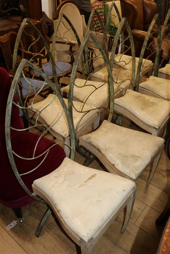 Nine green patinated iron Gothic style dining chairs